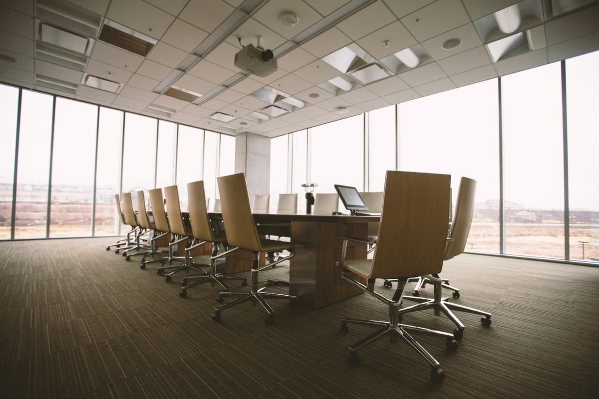 Modern conference room with chairs and a desk